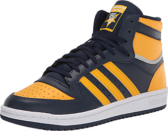 navy blue and yellow adidas shoes