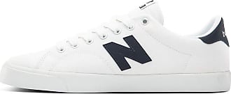 solid white new balance shoes