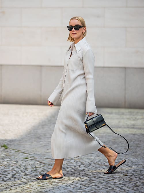 BERLIN, GERMANY - JULY 25: Tina Haase is seen wearing Nanushka dress in creme white, Jil Sander flats in black, Jacquemus bag, Chanel sunglasses on July 25, 2021 in Berlin, Germany. (Photo by Christian Vierig/Getty Images)