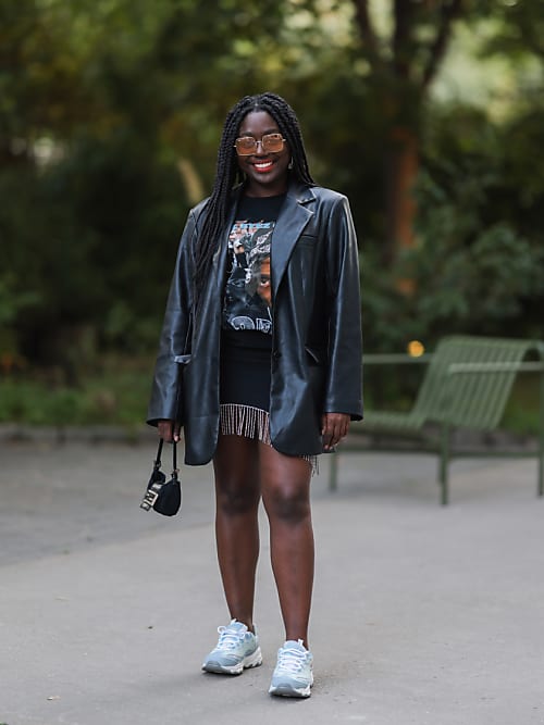 BERLIN, GERMANY - SEPTEMBER 07: Lois Opoku wearing a black leather jacket, a black dress and sneakers on September 07, 2021 in Berlin, Germany. (Photo by Jeremy Moeller/Getty Images)