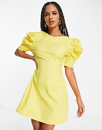 NA-KD open back mini dress in yellow