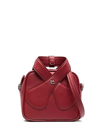 Derodeloper.com - #COURREGES #WOMEN FALL/WINTER '22 The Loop bag in  leather is inspired from the straps of a criss cross Courrèges dress from  1976. Revisited for the Spring Summer 2022 collection on